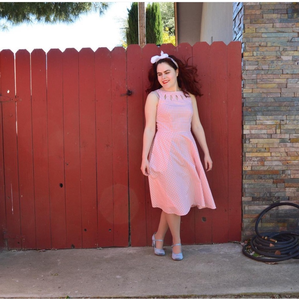 Gingham orange and white tea length retro style dress.